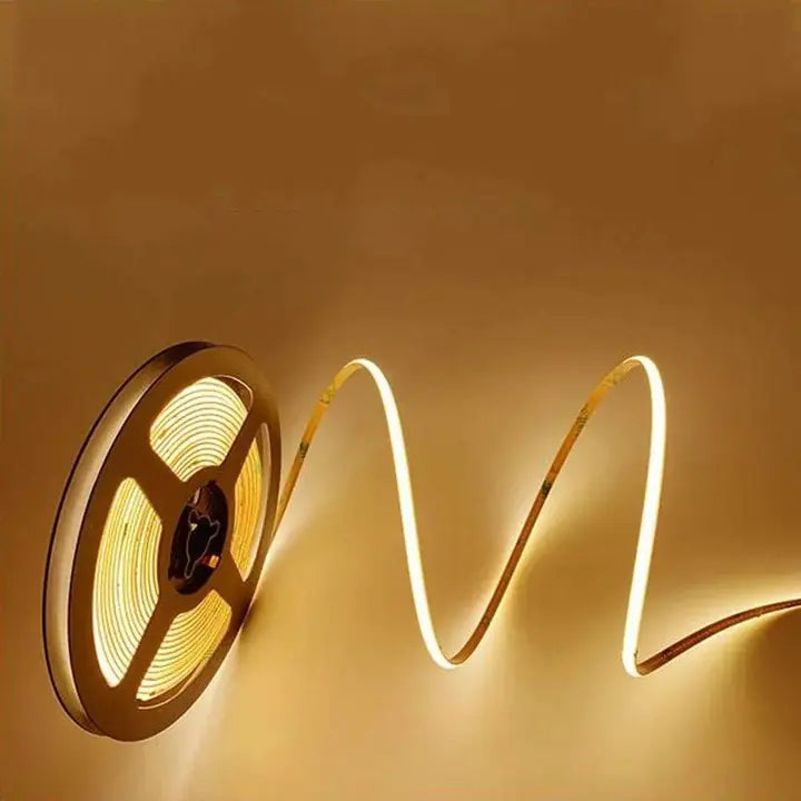 A reel of 3 mm COB flexible LED strip, lit warm white